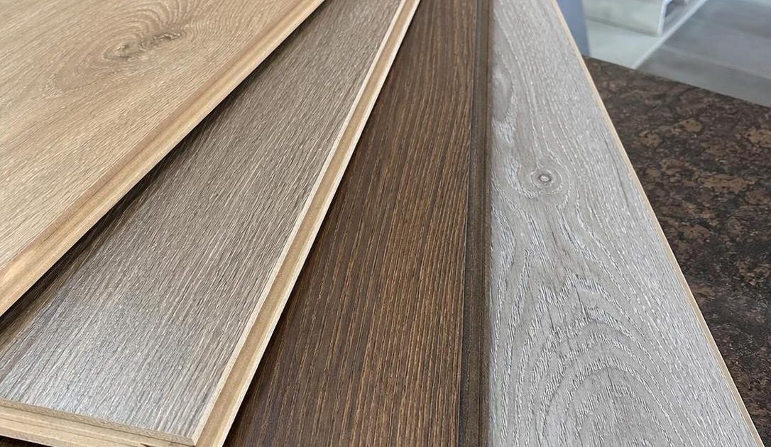 Laminate flooring plank samples in different wood tones