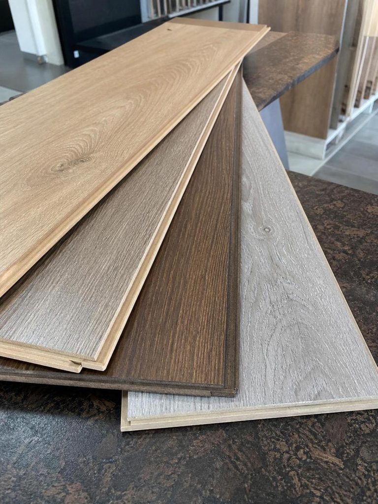 Laminate flooring plank samples in different wood tones